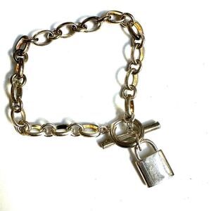 Silver tone locket charm bracelet